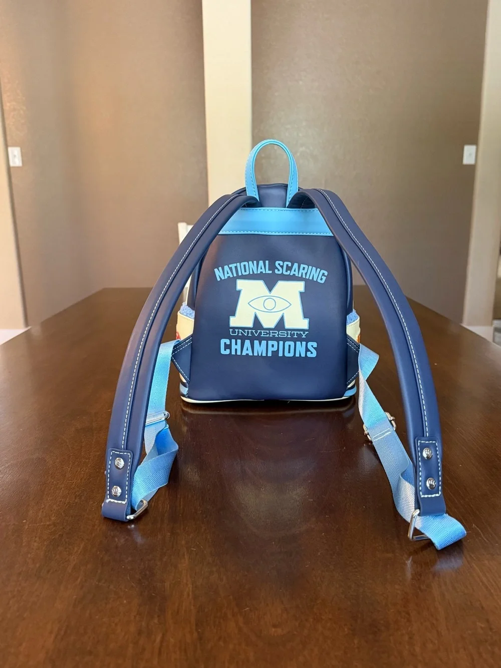 Loungefly Disney Parks Monsters University Varsity Jacket Mini Backpack